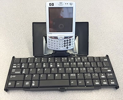 a mobile device attached to a portable keyboard