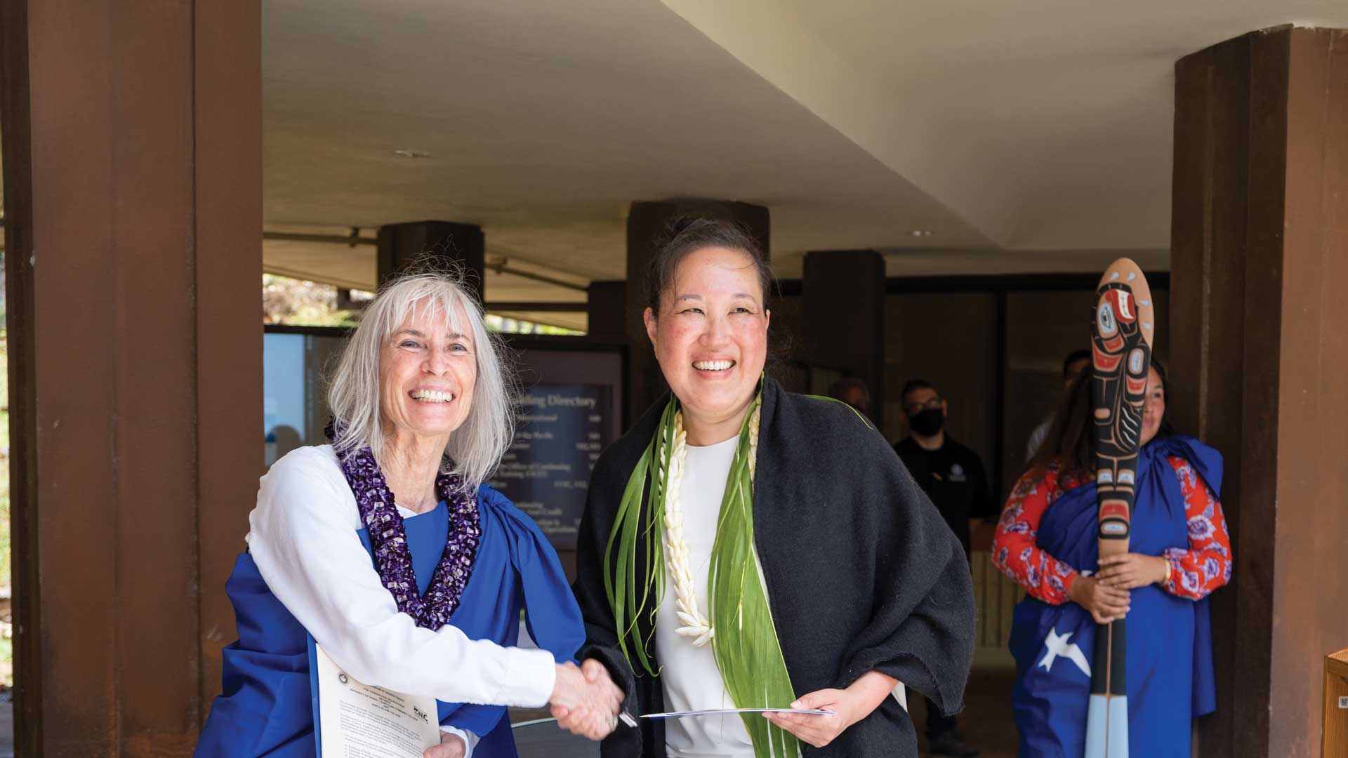 President Lisa Domae signing an agreement with a partner school in New Zealand