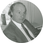 Dennis Wing sitting at his desk