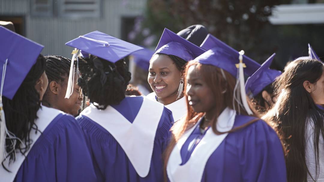 A group of graduates celebrate outside the convocation 2025 event