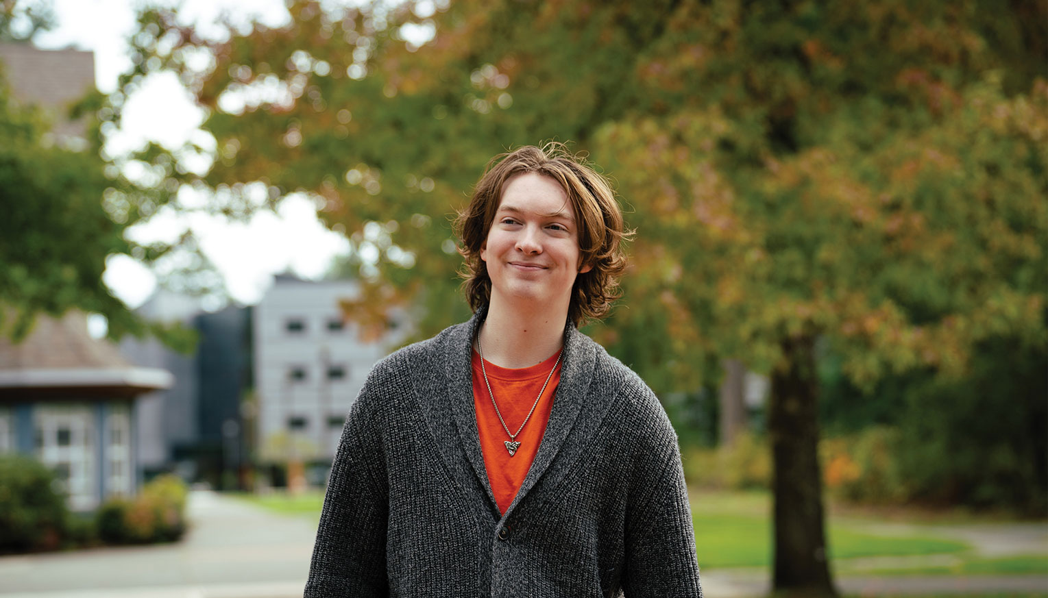 A student stands outside a college