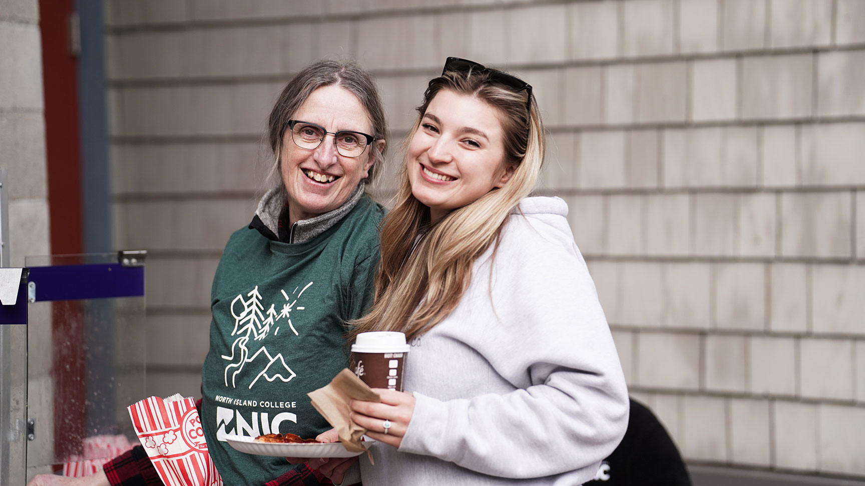 People gather for refreshments at college information fair