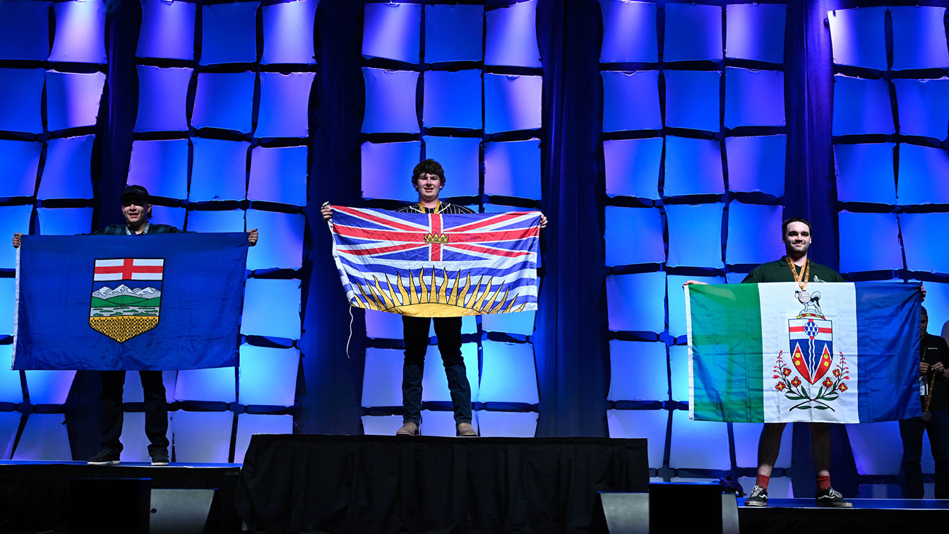 Skills Canada finalists hold their provincial flags at 2026 ceremony