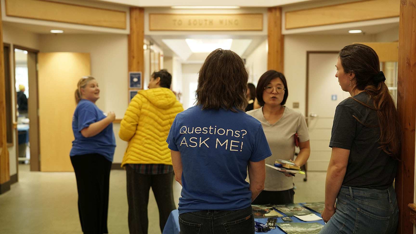 A group of people meet at student orientation event