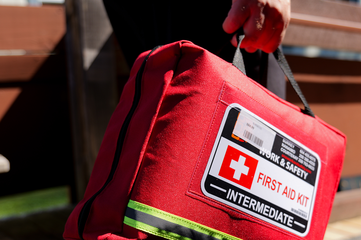 An NIC staff member carrying a first kit