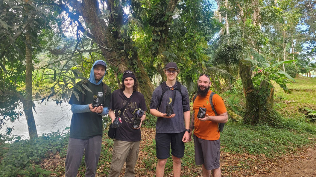 Students transport seedlings at Costa Rica cacao farm