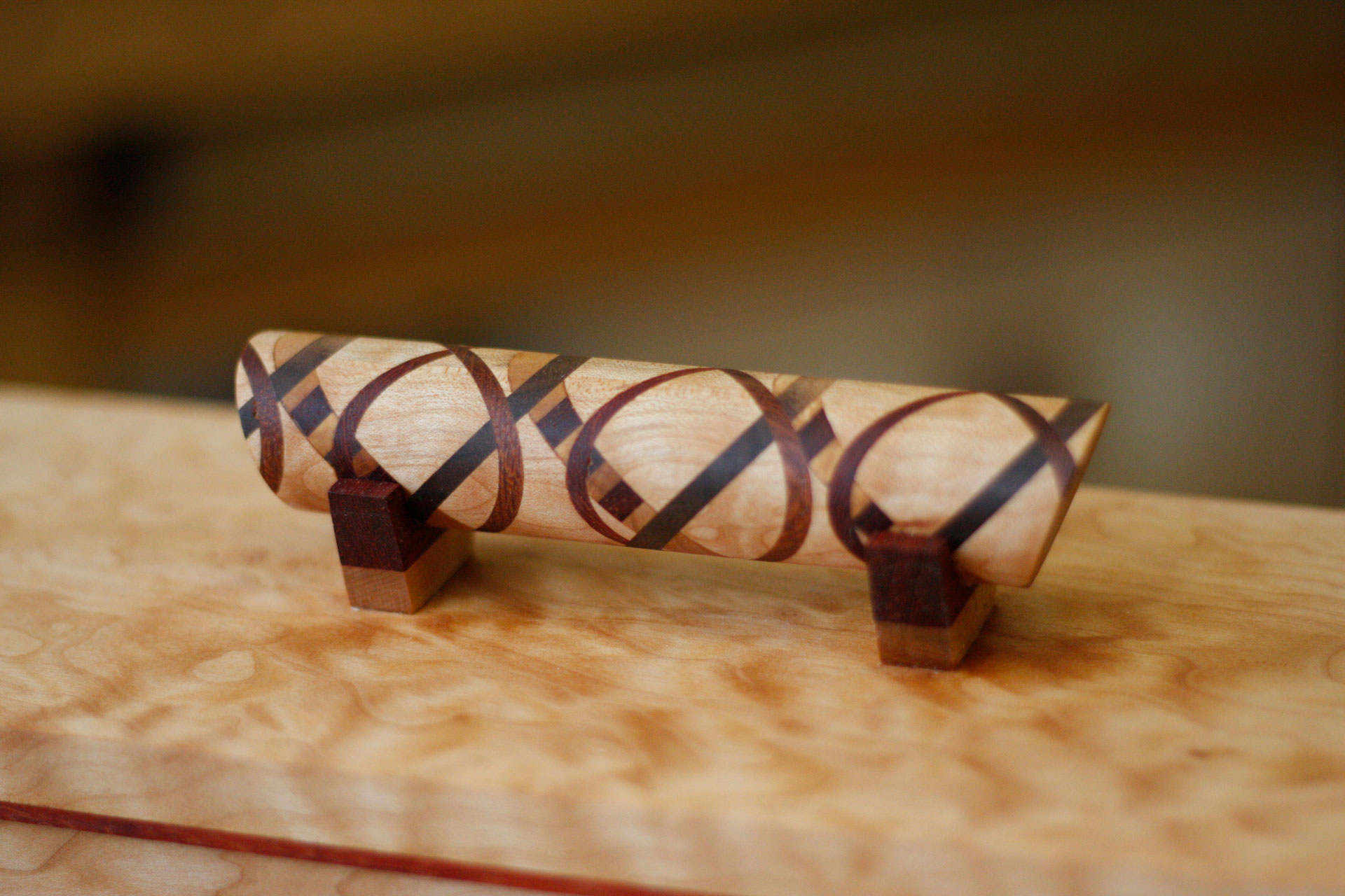 Detail of an intricately carved and inlayed drawer pull
