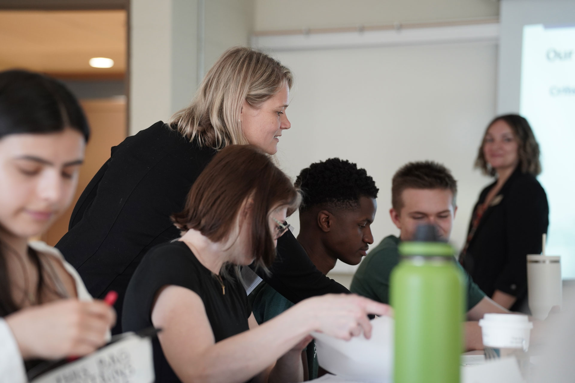 Students interacting with an instructor in an NIC classroom