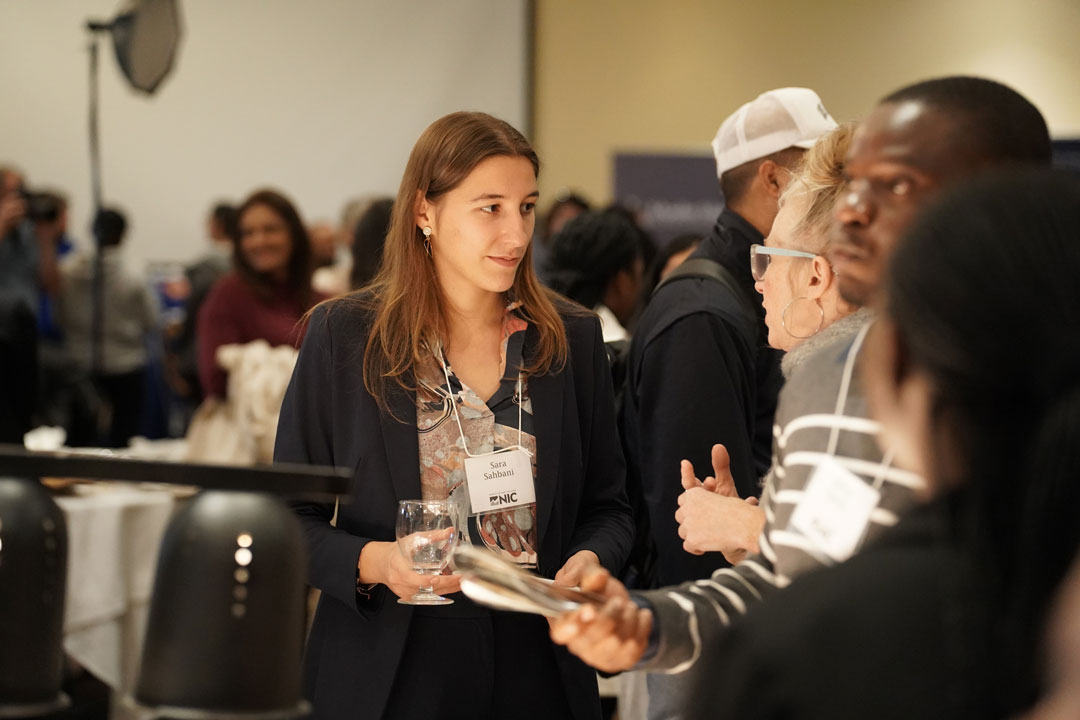 NIC Business student speaks to a potential employer at the Work-Integrated Learning networking night.