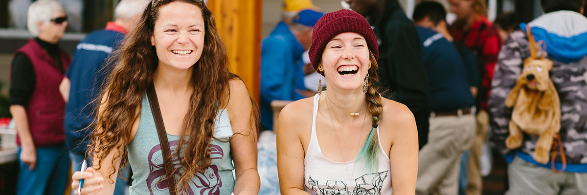 Two women laughing at an NIC on-campus event