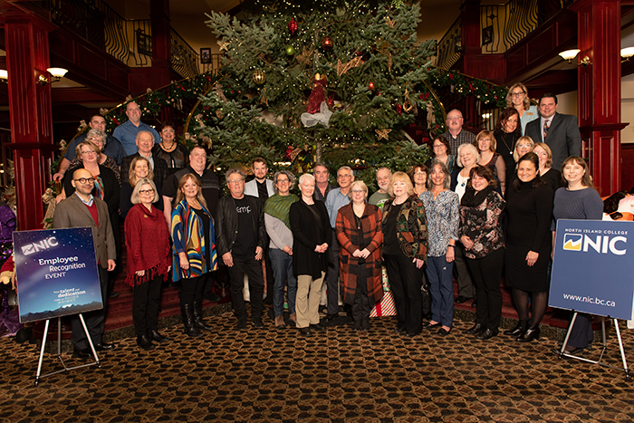 Group of NIC employees at recognition event during the holiday season