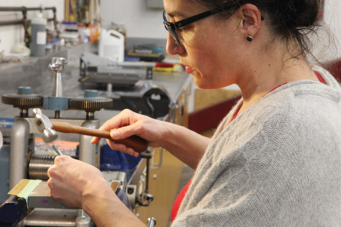 NIC Metal Jewellery Program holding...