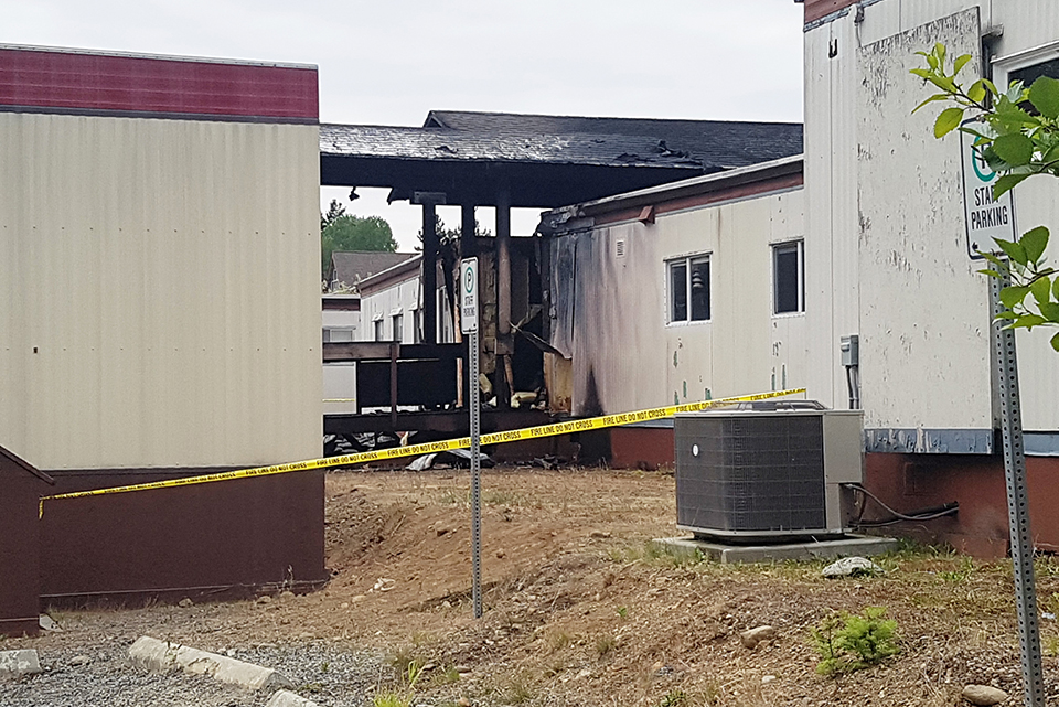 Fire damages four small buildings at...